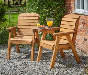 Richmond Companion Seat With Coffee Table in a garden