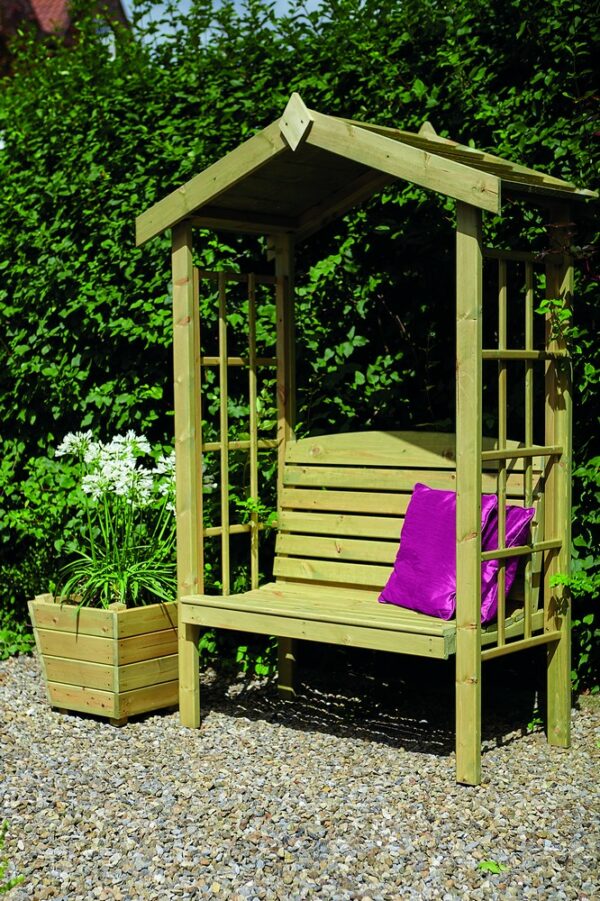 Green garden arbour with pink cushions.