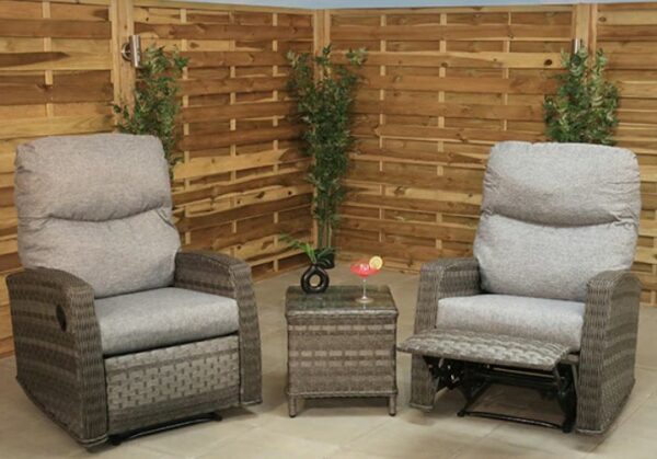 Two grey reclining garden chairs with a coffee table between them.