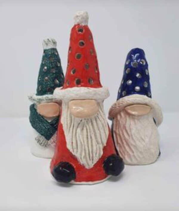 Three Christmas gonks in various sizes and colours.