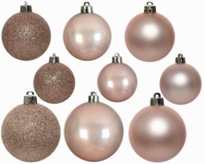 9 mixed sizes and finishes of blush pink coloured baubles.