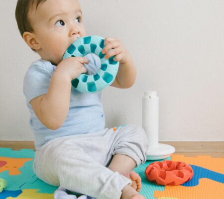 Baby playing with teething toy