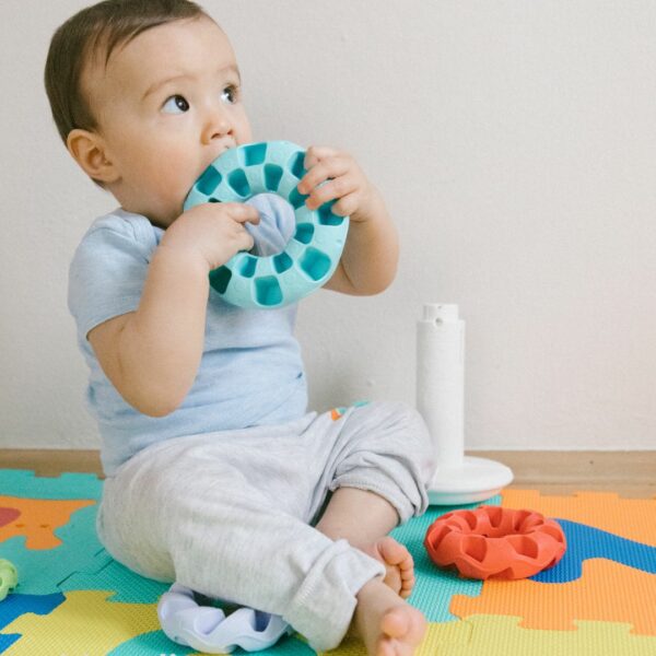 Baby playing with teething toy